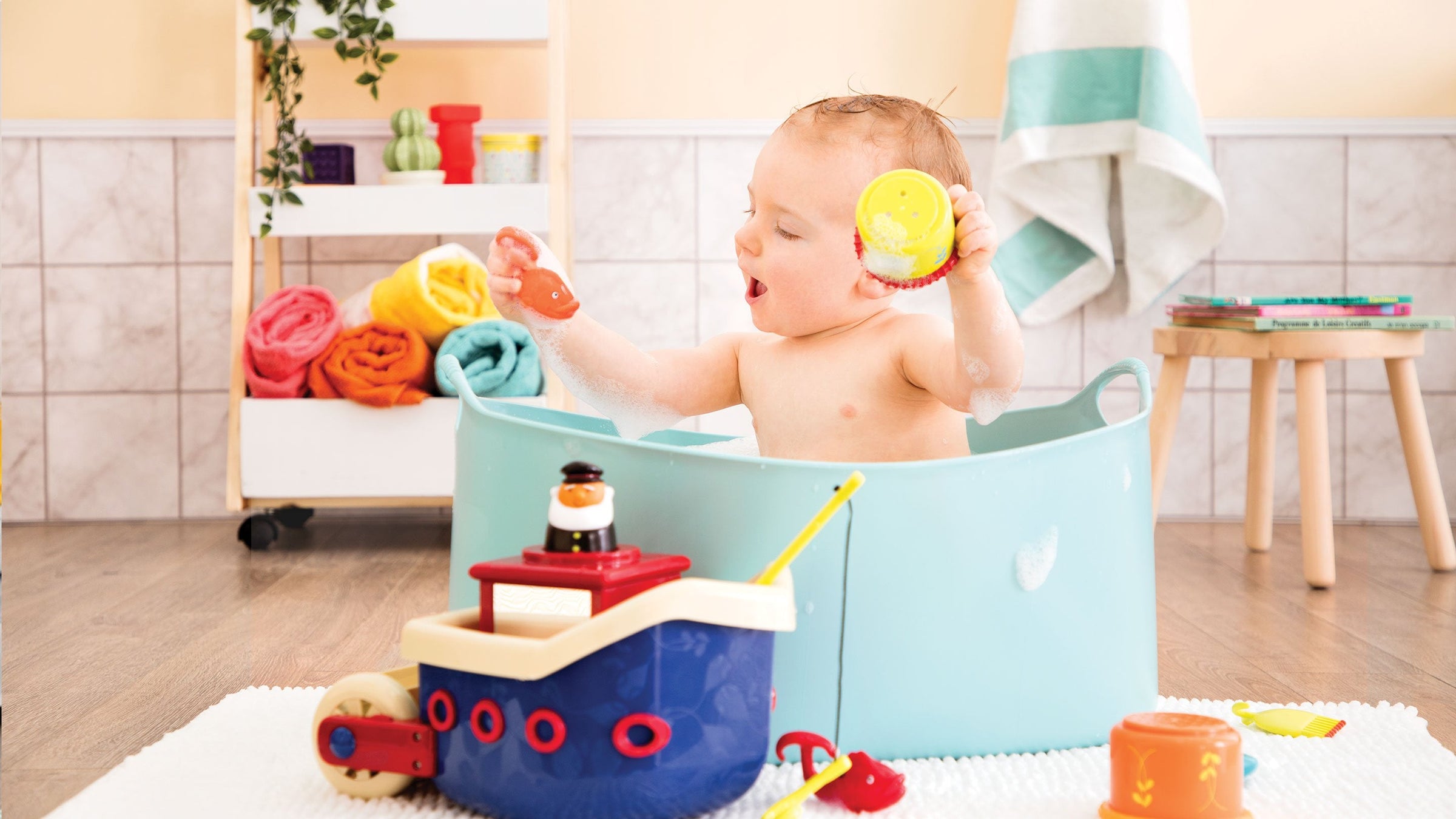 Kid playing with Bath toys