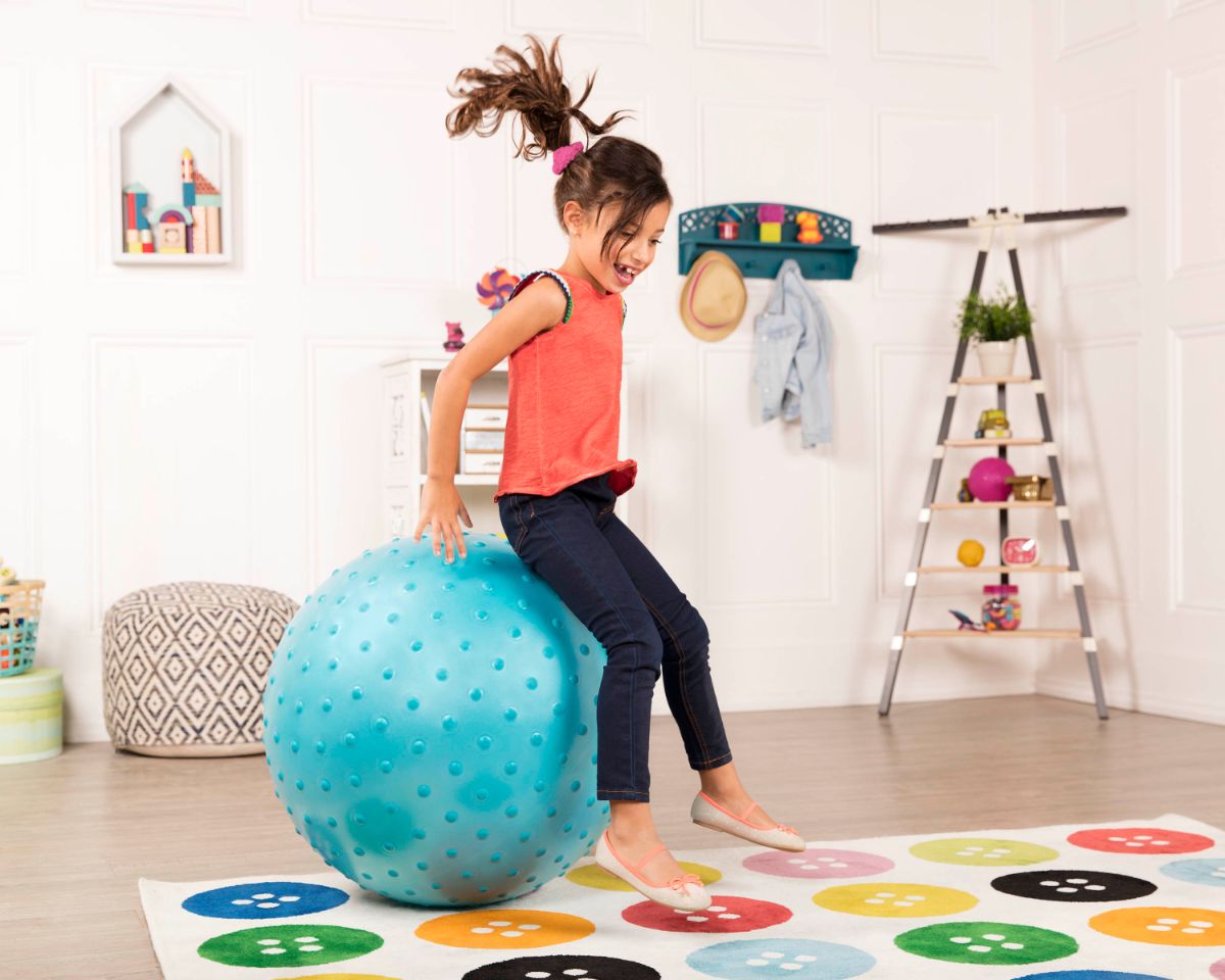 Kid on bouncy ball.